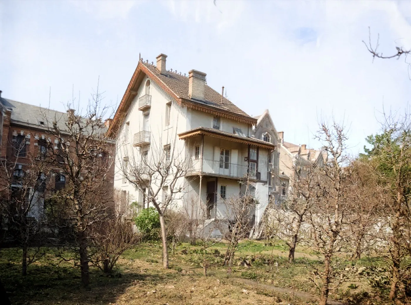 The same house with the spotting gone and an even sky, returned in colour
